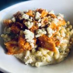 A Bowl Of Macaroni And Cheese Topped With Buffalo Chicken And Crumbled Blue Cheese.,Bevy's Tavern, West Des Moines